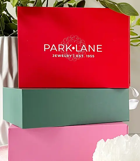 A stack of colored monthly Sparkle Boxes