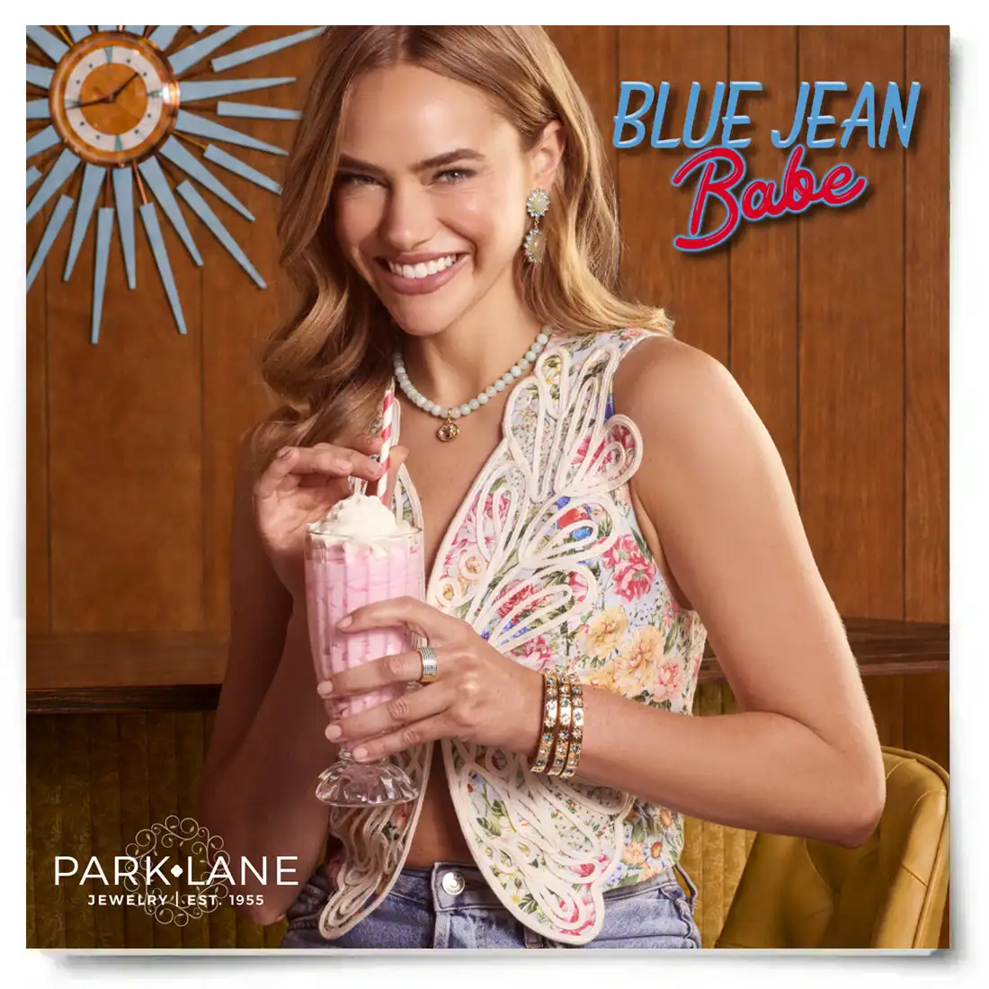 Blue Jean Babe jewelry catalog cover featuring a smiling woman wearing statement jewelry and holding a pink milkshake
